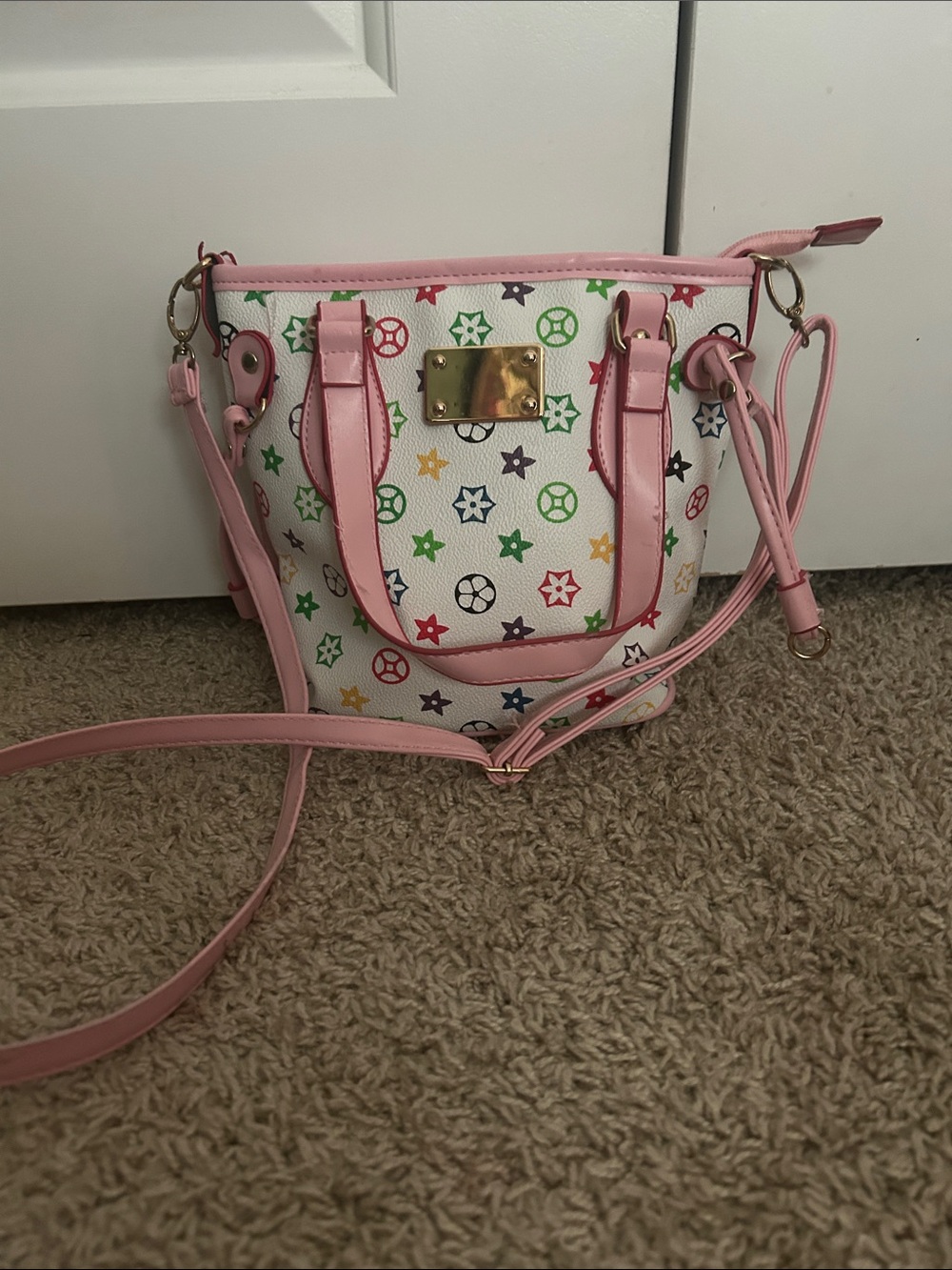 A Classy Chic Boutique White Mini Satchel with Pink Trim and Multicolor Stars